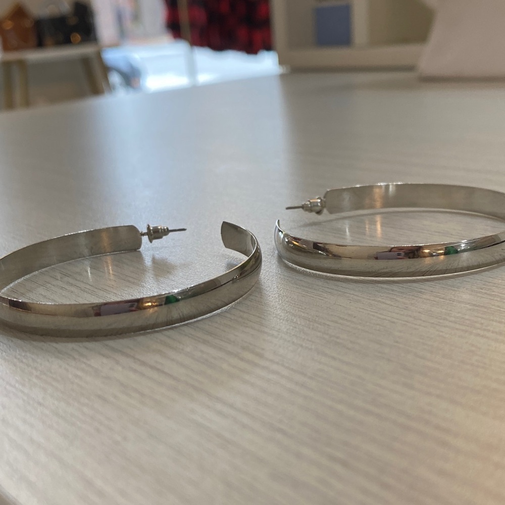 Silver tone hoop earrings